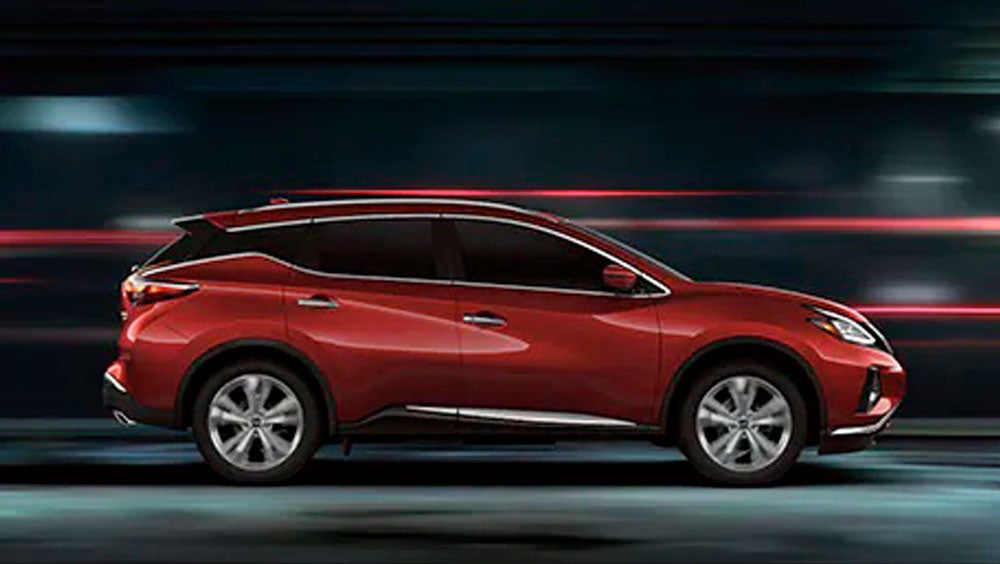 2023 Nissan Murano shown in profile driving down a street at night illustrating performance. | LOUGHEAD NISSAN in Swarthmore PA
